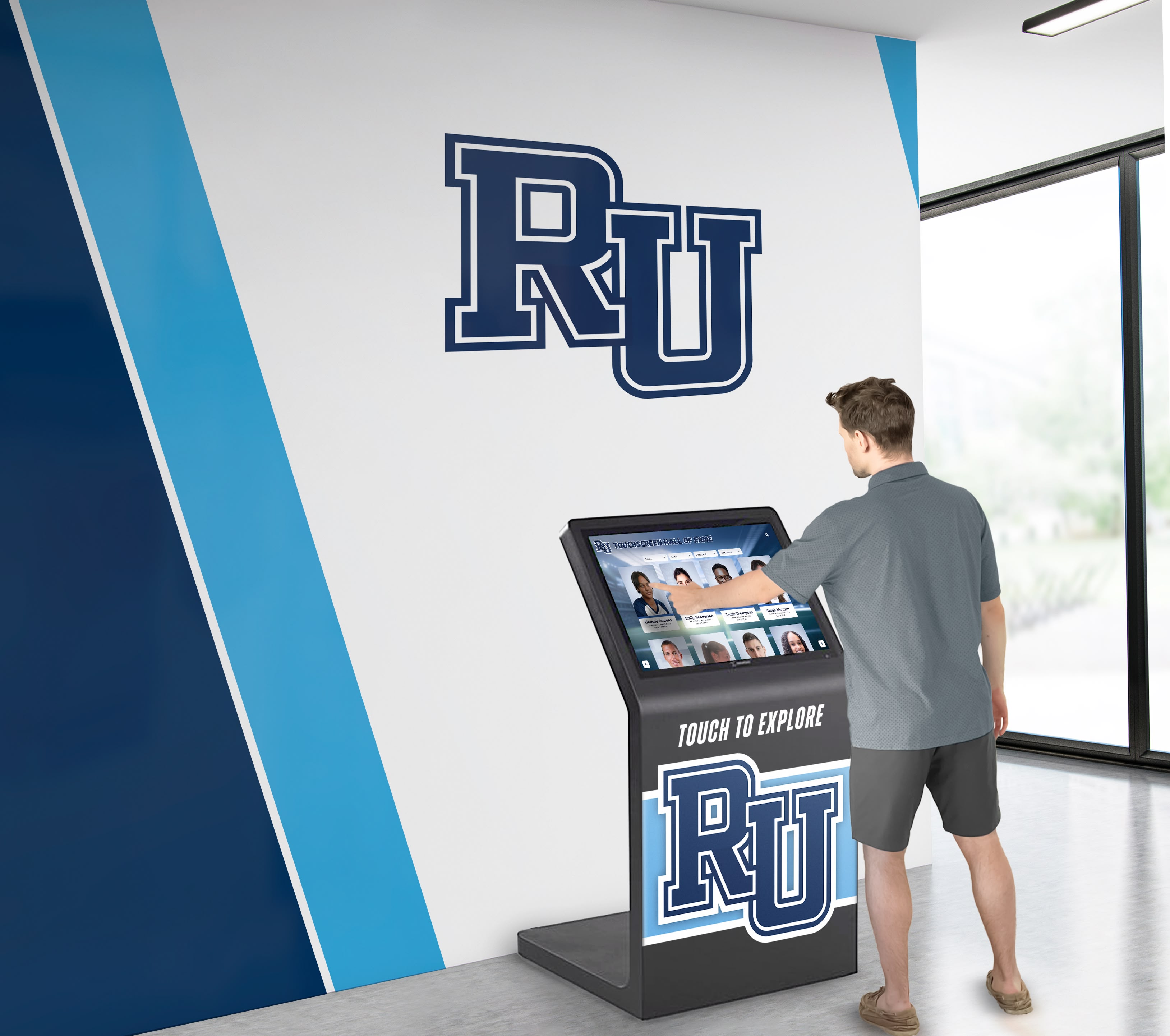 Student using interactive alumni kiosk in campus lobby