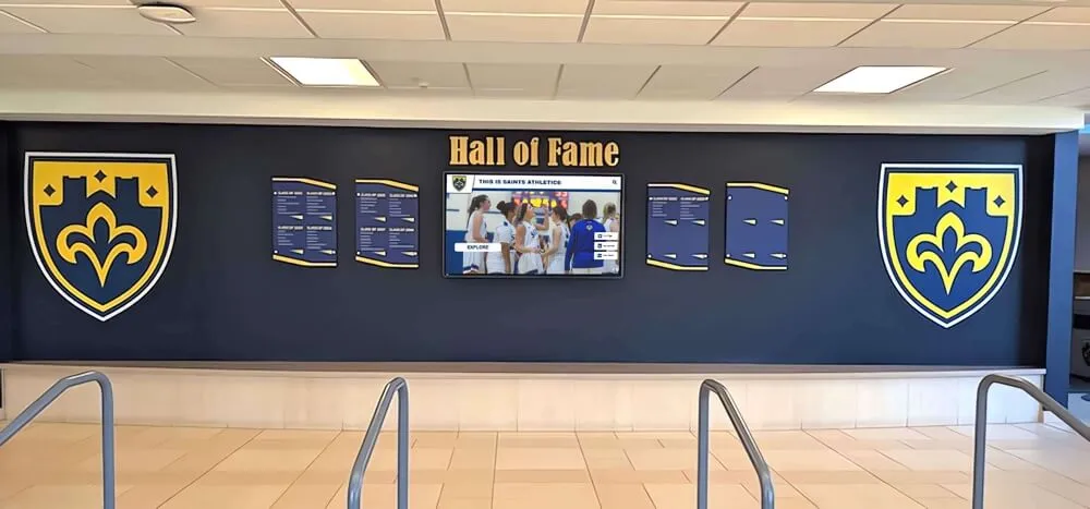 Traditional athletic hall of fame wall with shields and plaques