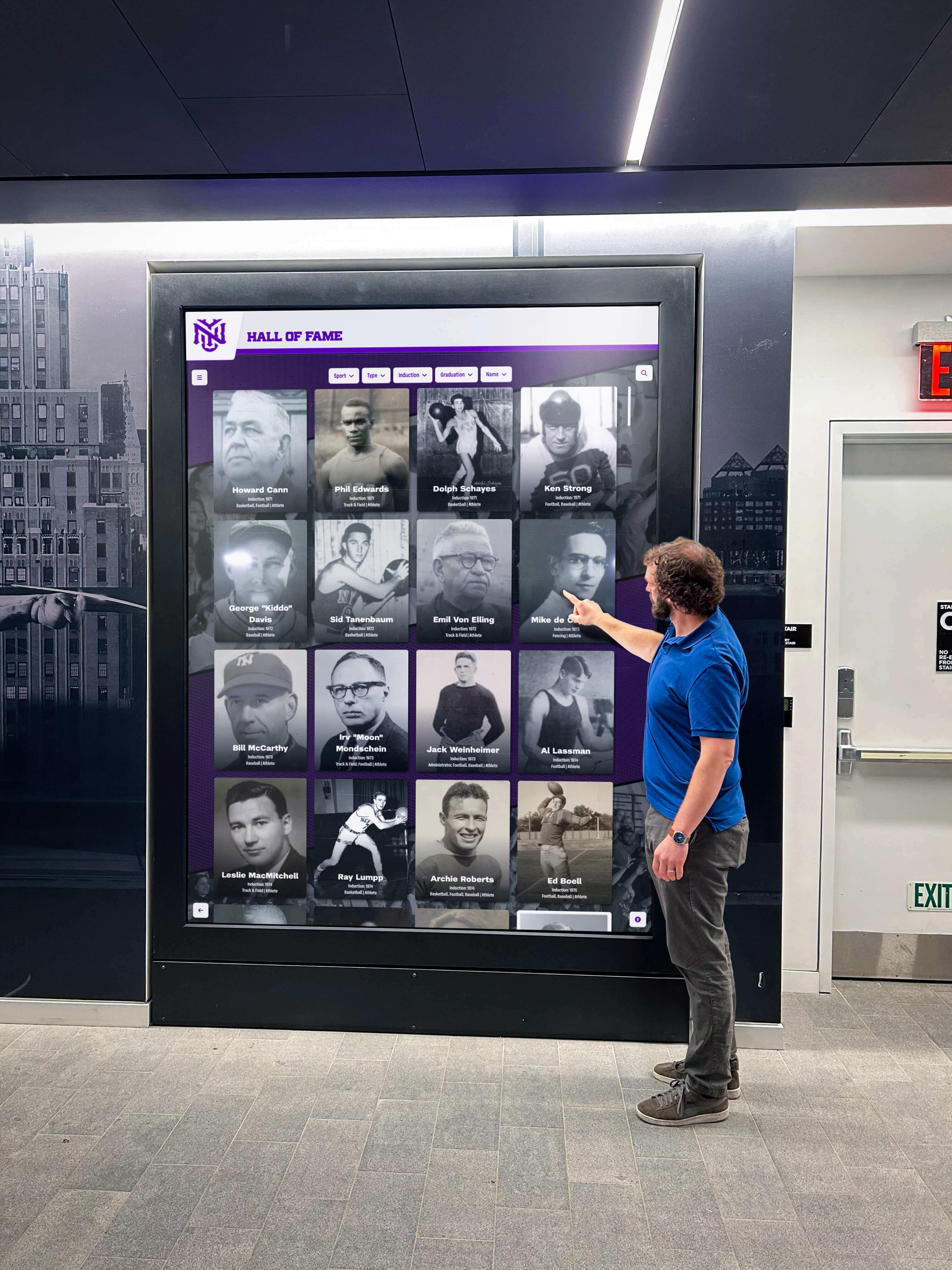 Visitor interacting with AI-powered recognition display